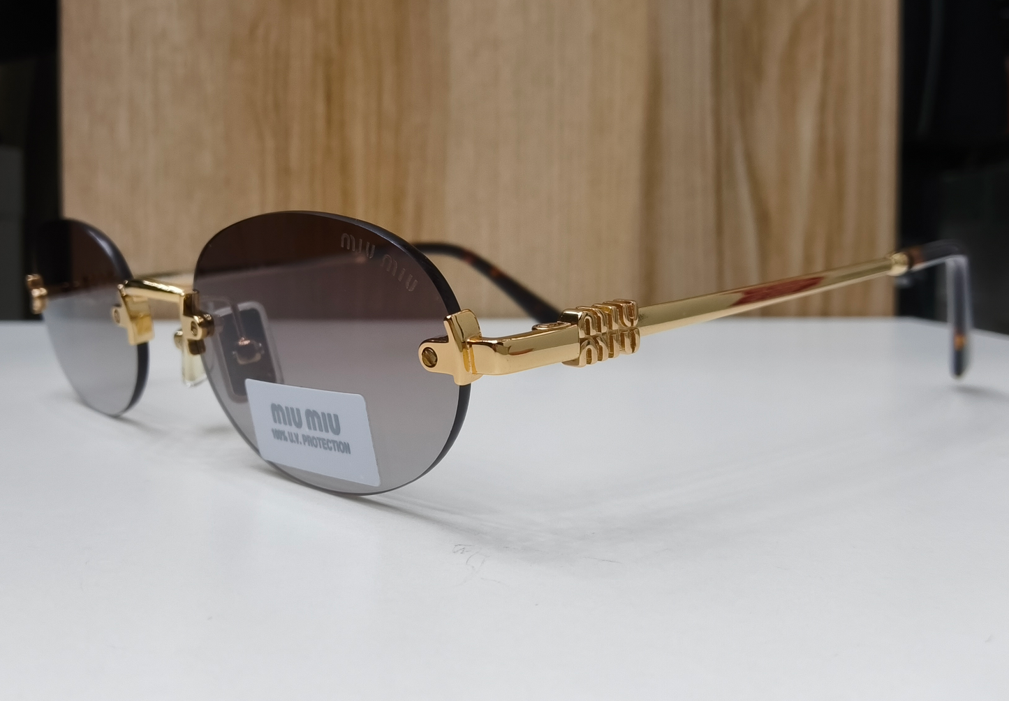 Miu Miu MU A54S rimless oval sunglasses