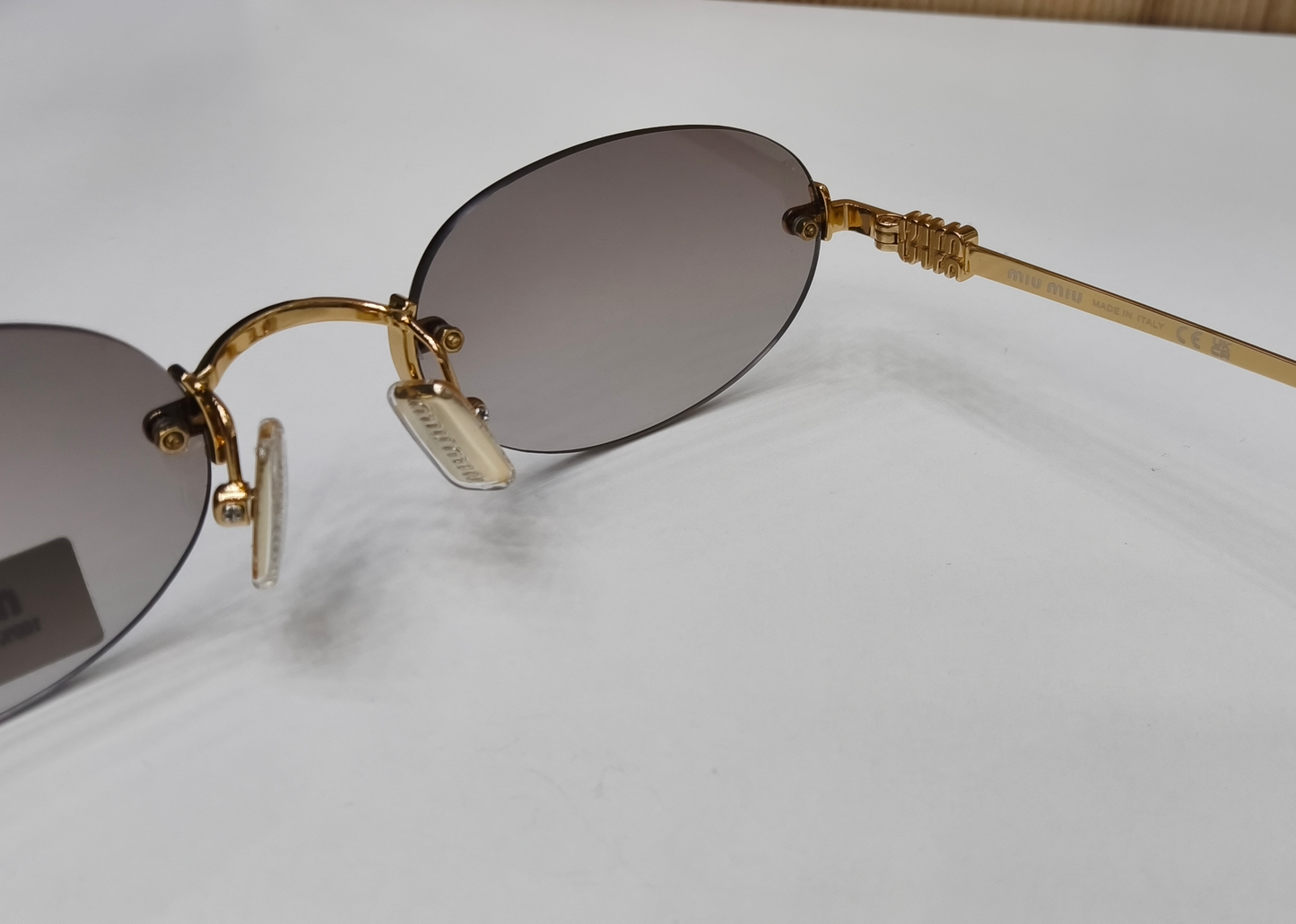 Miu Miu MU A54S rimless oval sunglasses