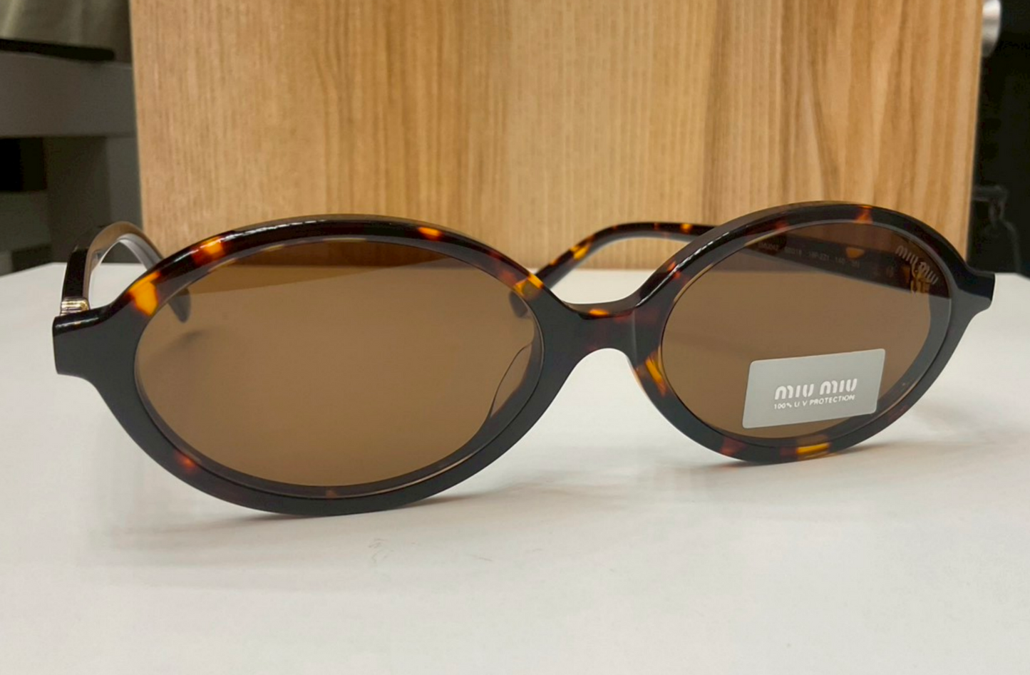 Miu Miu Regard Oval Sunglasses