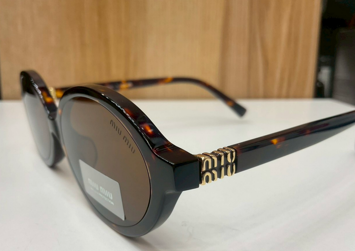 Miu Miu Regard Oval Sunglasses