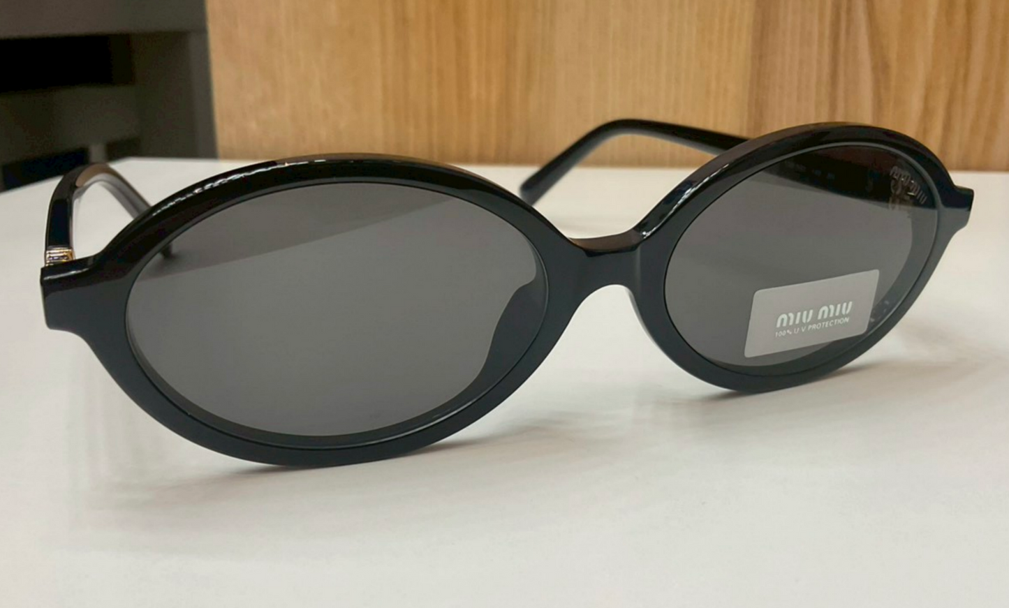 Miu Miu Regard Oval Sunglasses