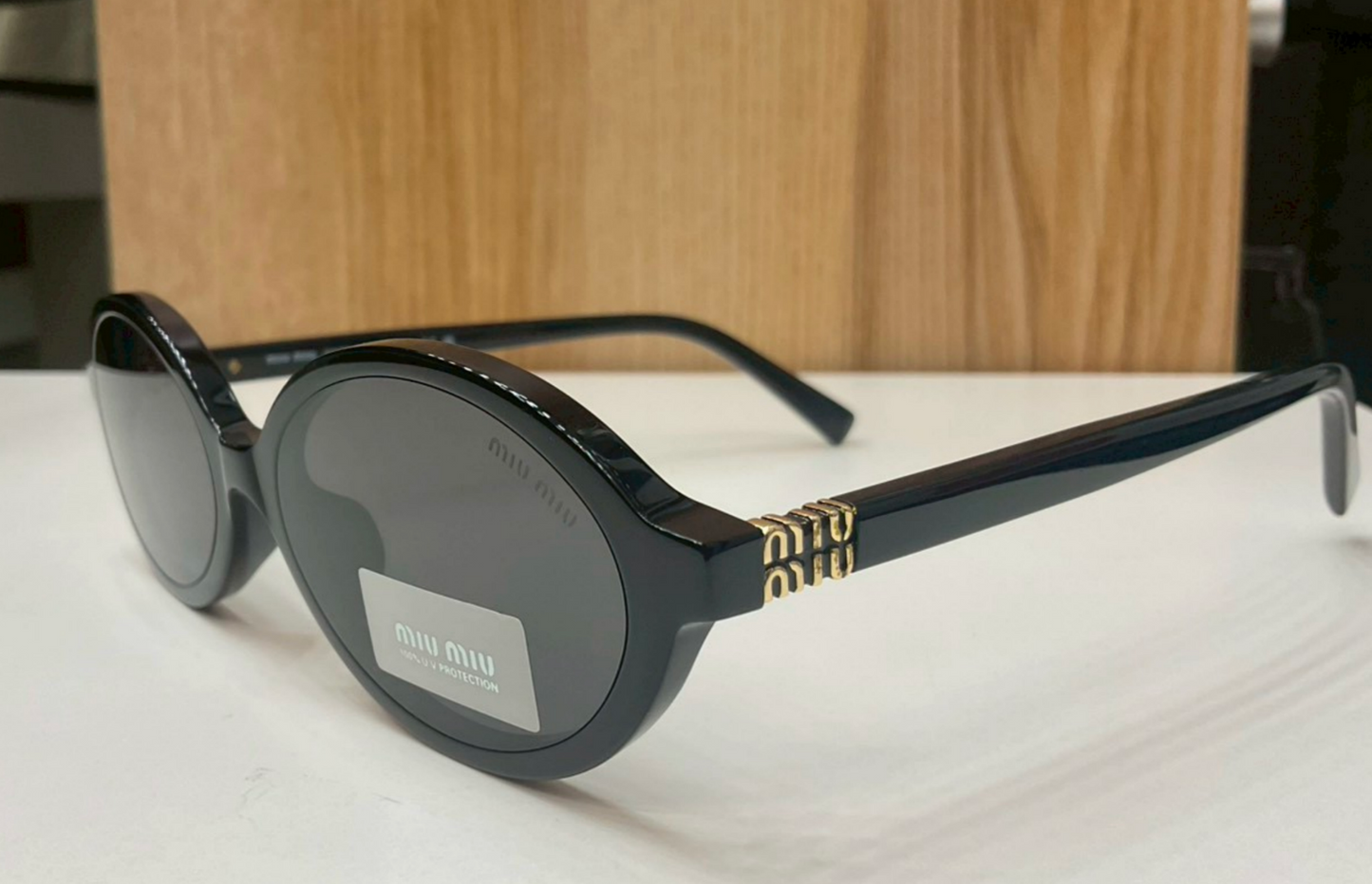 Miu Miu Regard Oval Sunglasses