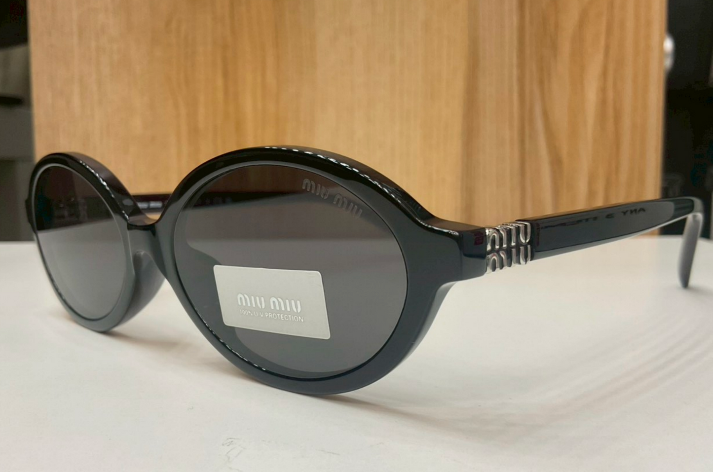 Miu Miu Regard Oval Sunglasses