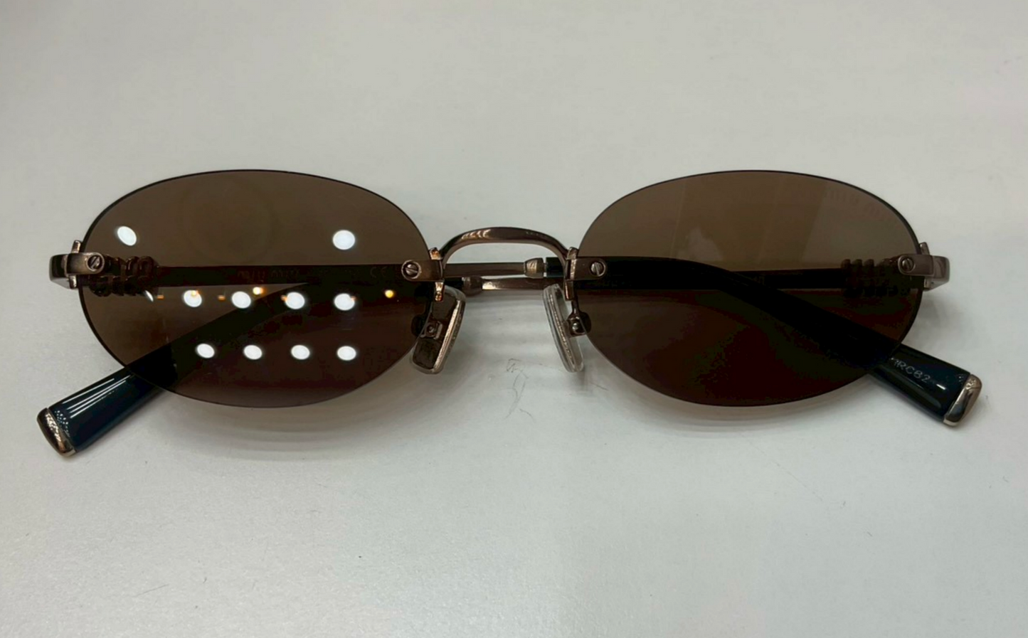 Miu Miu MU A54S rimless oval sunglasses