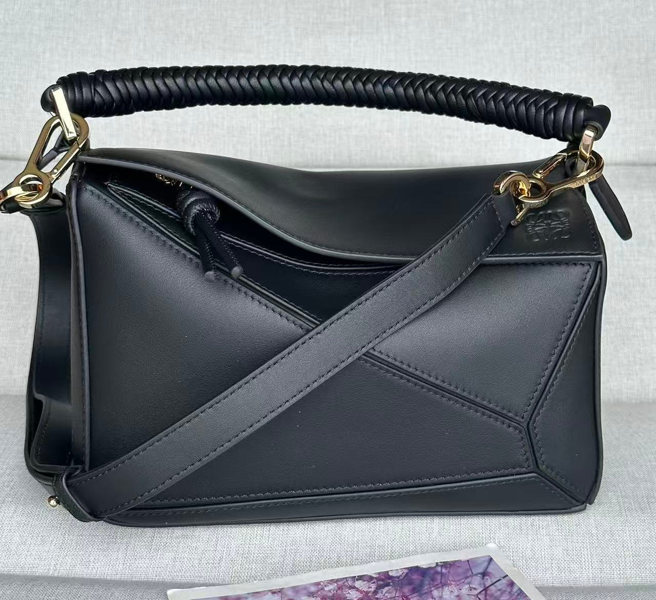 Puzzle Edge small leather top handle bag